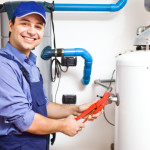 Technician repairing an hot-water heater